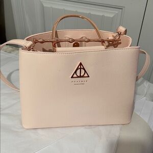 Deathly Hallows Blush Crossbody Bag. New with tag